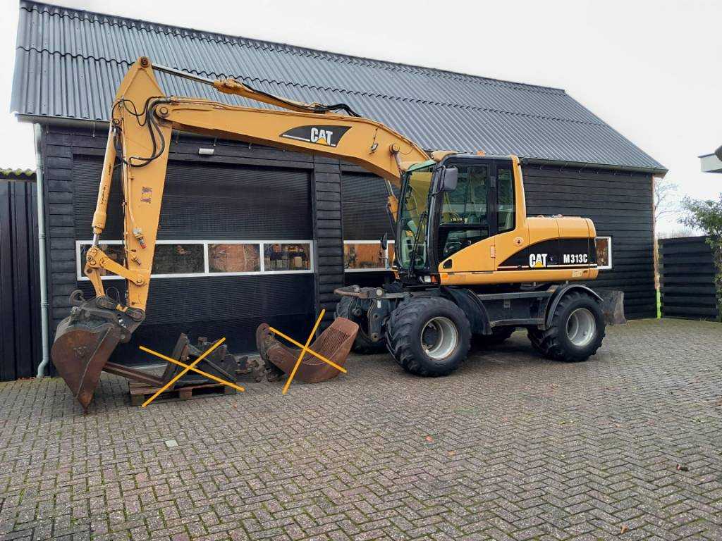 CAT M 313 C  graafmachine kraan