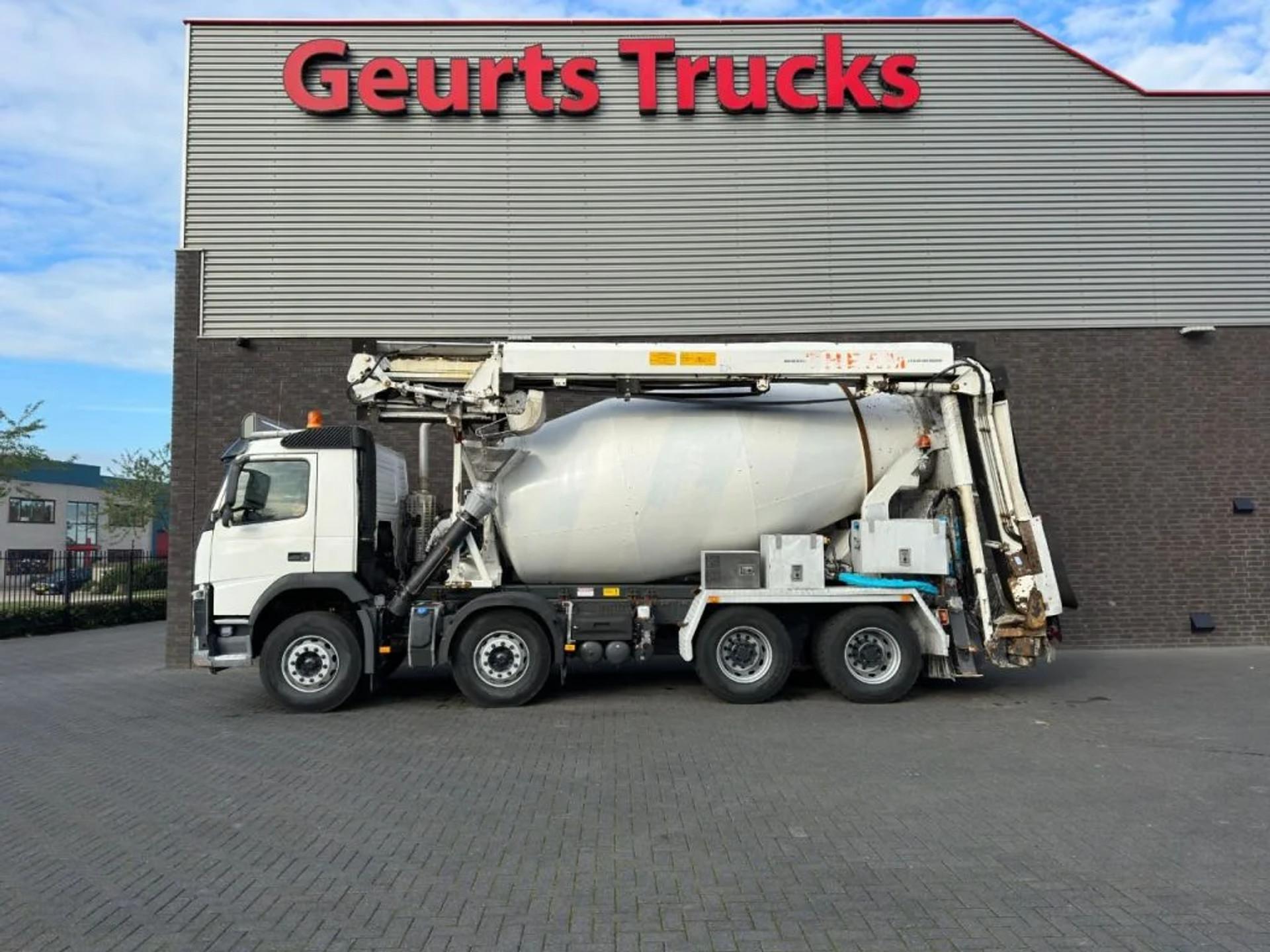 Foto 1 van Volvo FM 410 8X4 + STETTER 9 M3 MIXER/MISCHER + THEAM 15 M TRANSPORTBAND/BELT