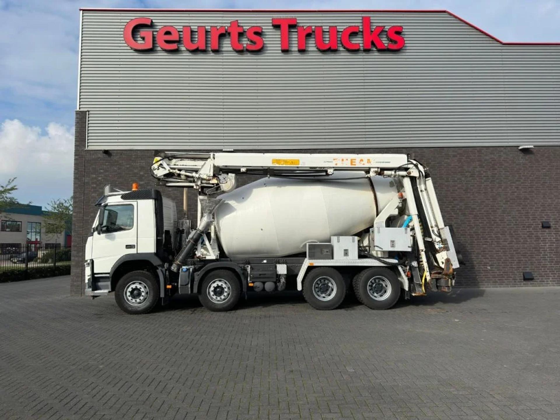 Foto 1 van Volvo FM 410 8X4 + STETTER 9 M3 MIXER/MISCHER + THEAM 15 M TRANSPORTBAND/BELT